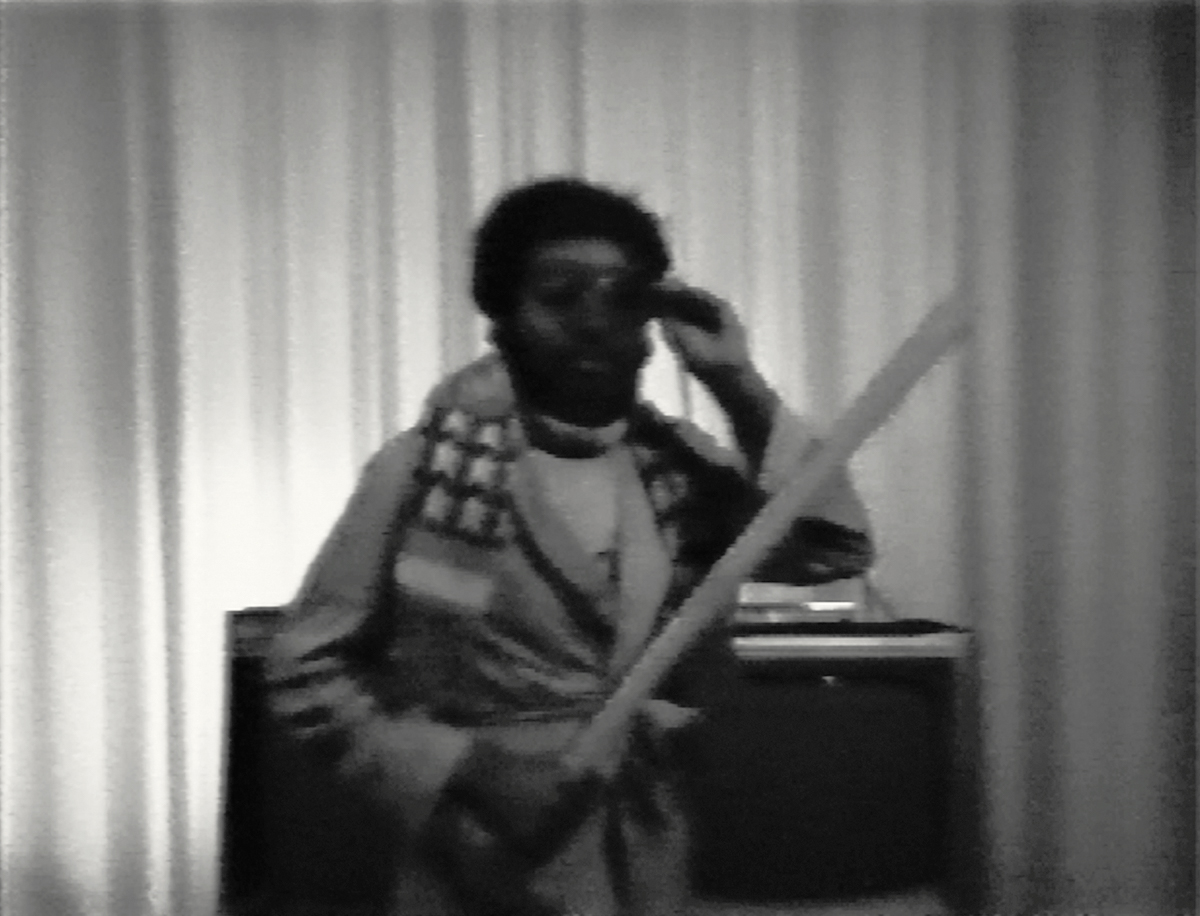 Ulysses Jenkins, Mass of Images (1978). Still from black and white video with sound, 4:15. Performance by Ulysses Jenkins. Video by Bob Dale. Courtesy of the artist.